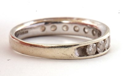 Lot 45 - A 9ct diamond ring, with channel set round...