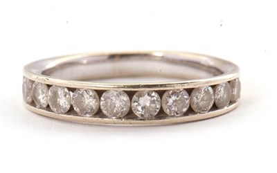 Lot 45 - A 9ct diamond ring, with channel set round...