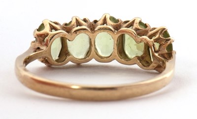 Lot 46 - A 9ct peridot ring, the five oval peridots...