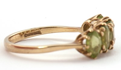 Lot 46 - A 9ct peridot ring, the five oval peridots...