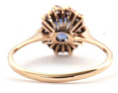 Lot 47 - A 9ct sapphire and diamond ring, the oval...