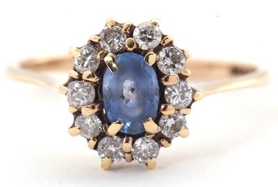 Lot 47 - A 9ct sapphire and diamond ring, the oval...