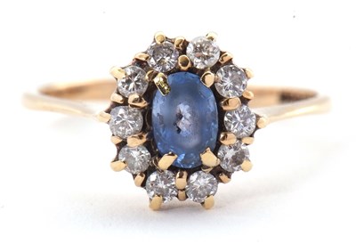 Lot 47 - A 9ct sapphire and diamond ring, the oval...