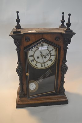 Lot 264 - A late 19th Century mantel clock set in an...