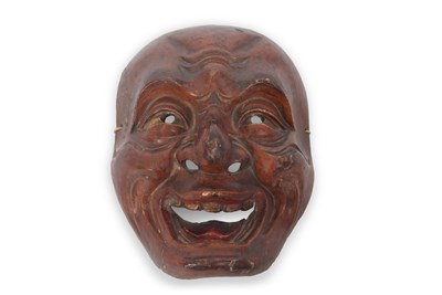 Lot 99 - A Japanese carved wall mask formed as a...