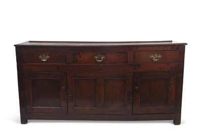 Lot 559 - An 18th Century oak dresser base with three...