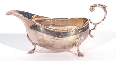 Lot 93 - Elizabeth II silver sauce boat, features a...
