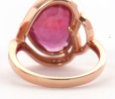 Lot 7 - A rose gold, ruby and diamond ring, the heart...