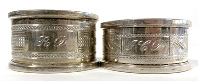 Lot 119 - Two Elizabeth II silver napkin rings of...