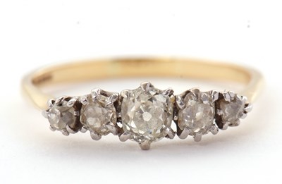 Lot 17 - An 18ct five stone diamond ring, the five...