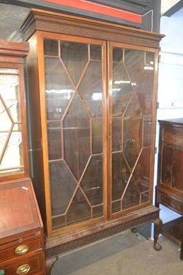 Lot 538 - An Edwardian bookcase cabinet in the Georgian...