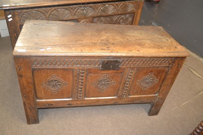 Lot 629 - An 18th Century oak coffer with carved three...