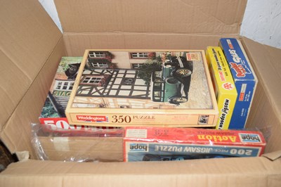 Lot 52 - Box of various motoring jigsaws, unchecked for...