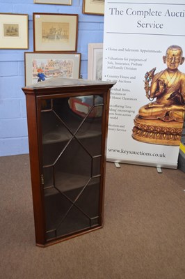 Lot 320 - Early 20th century mahogany corner cabinet...