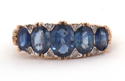Lot 31 - A 9ct sapphire and diamond ring, the five...