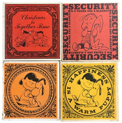 Lot 396 - SNOOPY. Charles M Schulz. Four volumes....