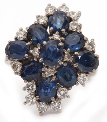 Lot 29 - An 18ct sapphire and diamond cluster ring, set...