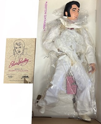 Lot 124 - A boxed Elvis Presley 21" vinyl figure by...