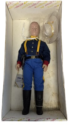 Lot 73 - A boxed John Wayne vinyl doll by Effanbee,...