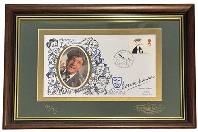 Lot 98 - SIR NORMAN WISDOM: Framed and glazed first day...