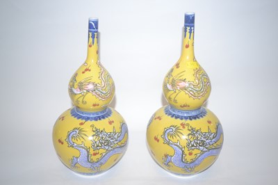 Lot 215 - A pair of Chinese porcelain vases of double...