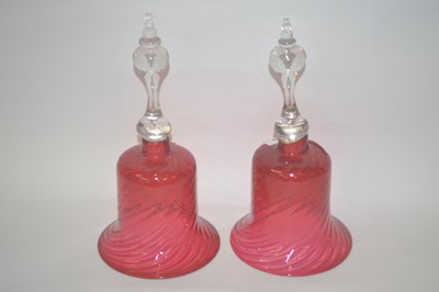 Lot 229 - Two cranberry glass bell shaped vases, 32cm high