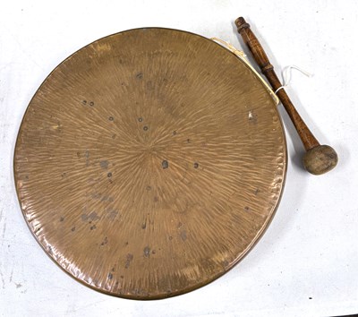 Lot 413 - A brass dinner gong, 31cm diameter with striker