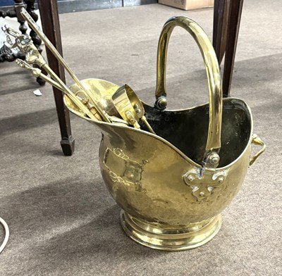 Lot 451 - A brass coal helmet and accompanying fire tools