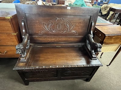 Lot 466 - A 20th Century oak monks bench of typical form...