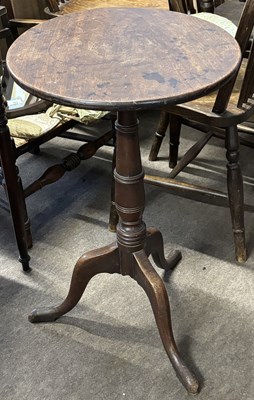 Lot 482 - A Georgian mahogany wine table set on a turned...