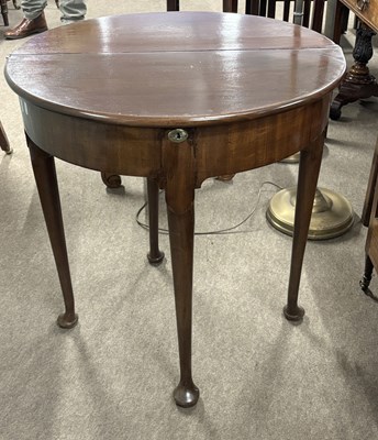 Lot 502 - A Georgian demi lune mahogany table with fold...