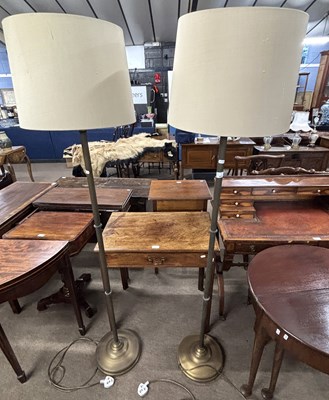 Lot 503 - A pair of 20th Century brass standard lamps of...