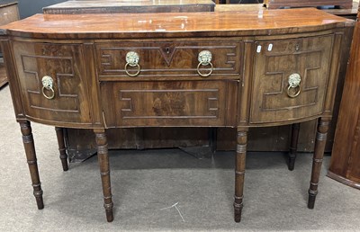 Lot 511 - A late Georgian mahogany bow front sideboard...
