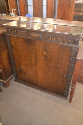 Lot 518 - An early 20th Century oak open front book case...