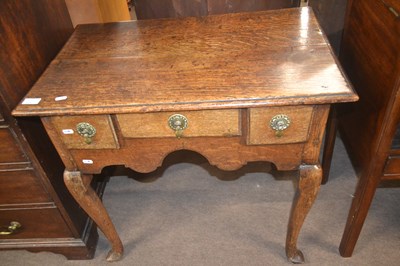Lot 528 - A George III oak low boy with three small...