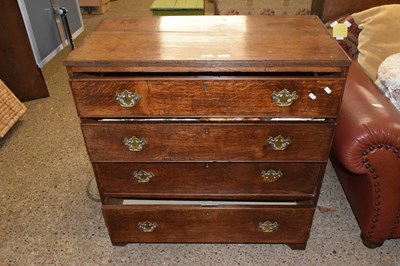 Lot 314 - A George III oak chest with four long drawers...