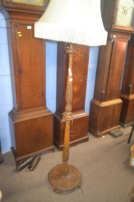 Lot 539 - An early 20th Century carved hardwood standard...