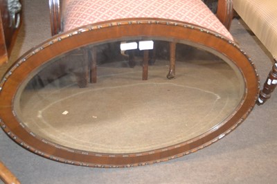 Lot 544 - An early 20th Century oval bevelled wall...