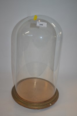 Lot 398 - A 20th Century circular glass dome with gilt...