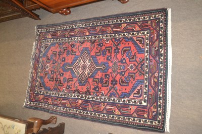 Lot 574 - A small 20th Century Middle Eastern floor rug...