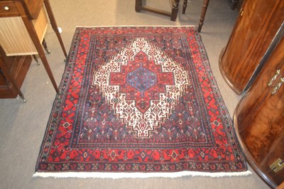 Lot 575 - A 20th Century Middle Eastern wool floor rug...