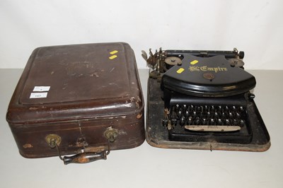 Lot 1 - A vintage Empire typewriter in metal...