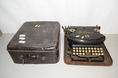 Lot 3 - A vintage Empire typewriter with metal travel...