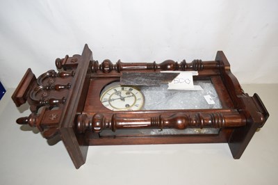 Lot 24 - A 19th Century wall clock in carved mahogany...