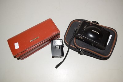 Lot 52 - An Olympus camera in case together with a...
