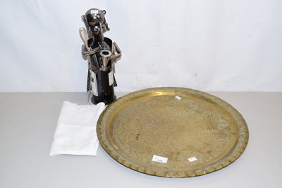 Lot 128 - A circular brass tray with a metal wine...