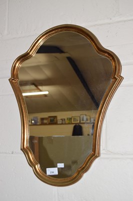 Lot 236 - Hall mirror in shaped gilt frame