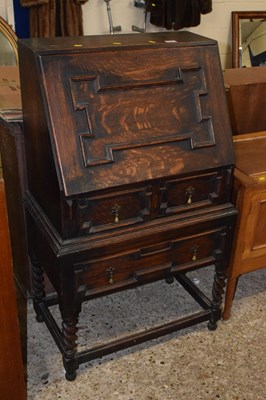 Lot 303 - An oak full front bureau