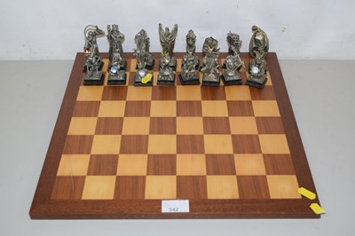 Lot 542 - A wooden chess board with pewter fantasy pieces