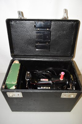 Lot 566 - A cased Singer sewing machine